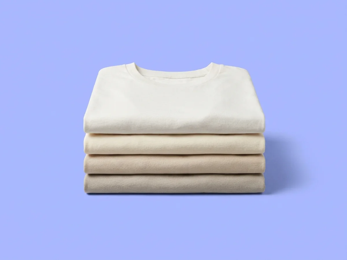 A stack of folded blank t-shirts